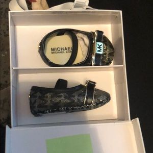 Baby Elsa Michael Kors shoes.